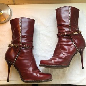 Kelsey red heel booties with gold accents.